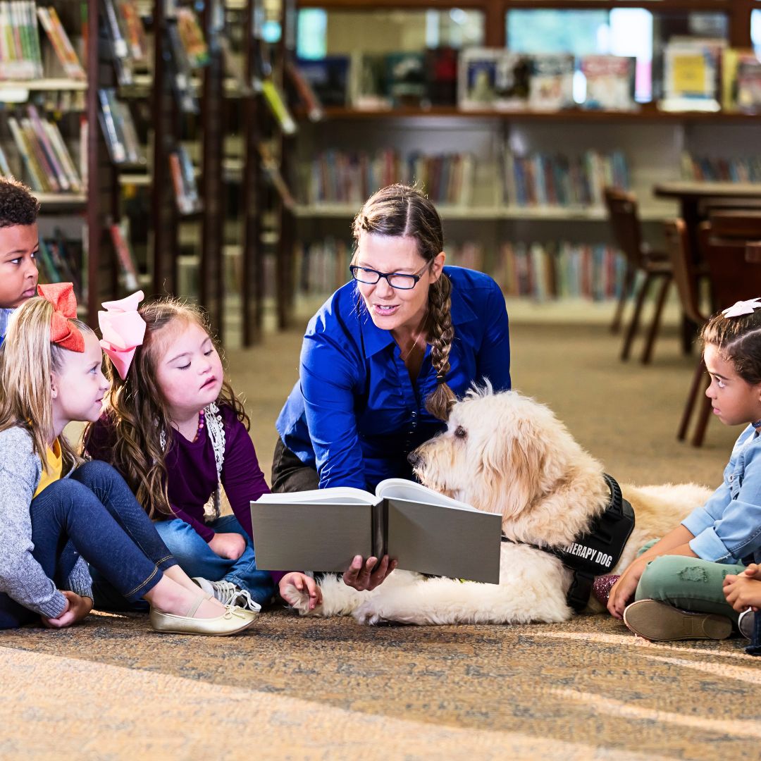 How can Labradoodles benefit children and adults with Autism?